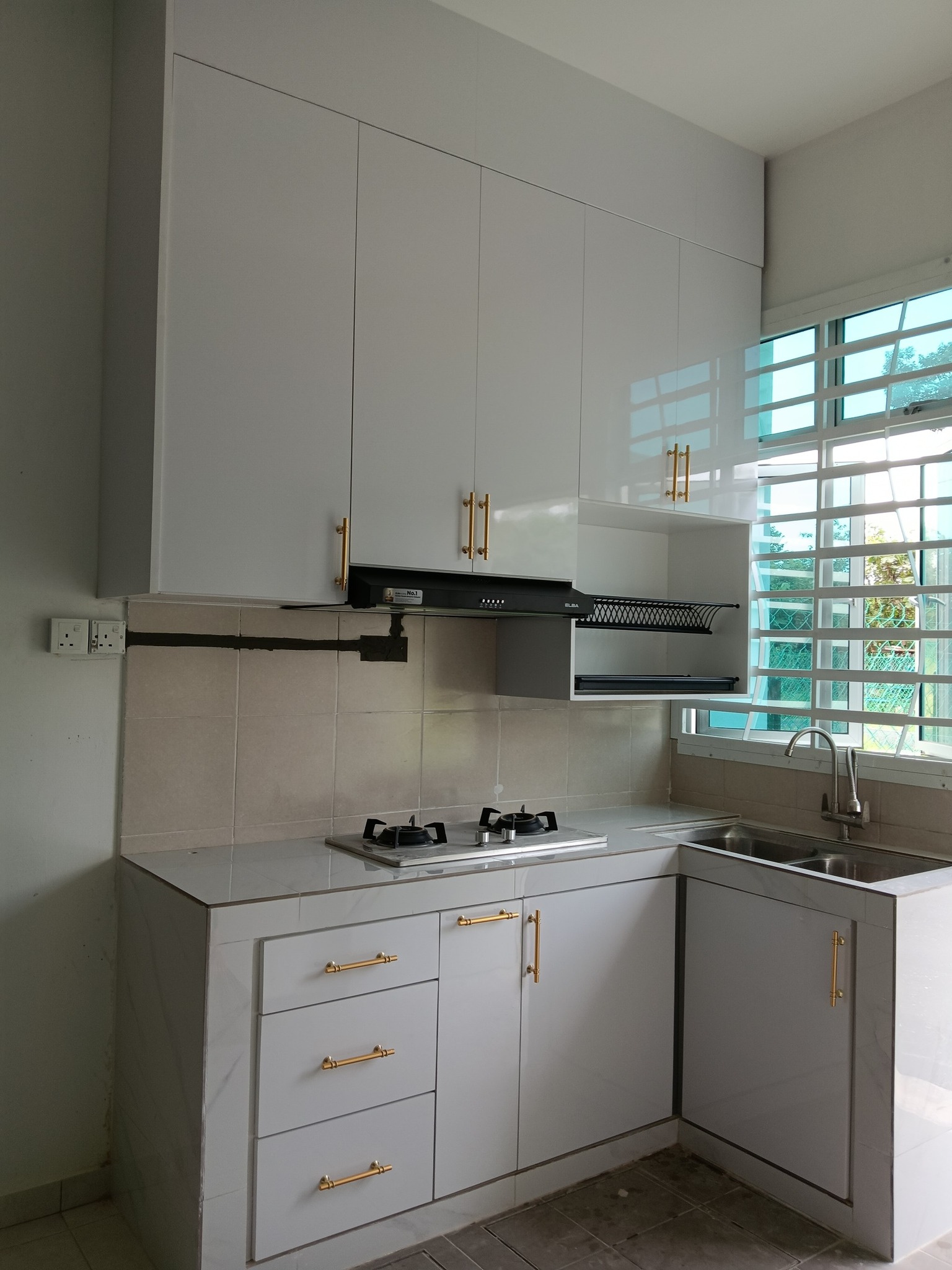 Kitchen cabinet project with gold handles